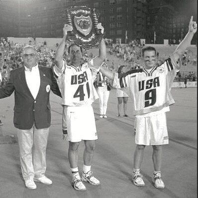 Millon (No. 9) alongside teammate John DeTommaso after Team USA captured the 1998 World Championship.